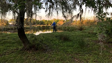 Man Fishing in Pond